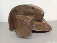Left side view of ceramic sculpture showing cubist contours