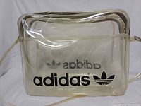 Front view showing Adidas logo and clear PVC body