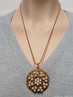 Pendant on mannequin showing scale and design