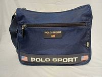 Front view showing Polo Sport branding, front zip pocket and overall condition.
