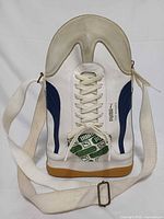 Front view showing Puma branding, green logo patch, zipper and strap