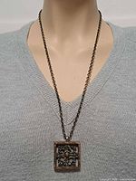 Necklace on mannequin showing pendant size and chain drop