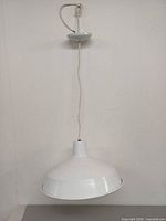 Lamp hanging to show full profile and cord