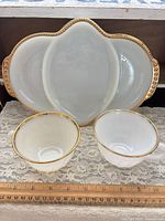 Dish and two cups front view with ruler for scale