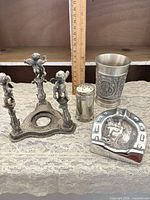 Group shot of all four metal items
