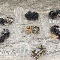 All six bagged pairs displayed on lace background