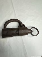 Full view of cylindrical padlock showing overall design and finish