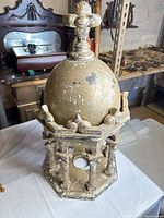 Full view of wooden gilt finial showing dome, knop and octagonal base