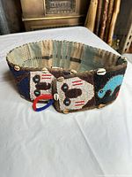 Full view of beaded belt showing front panel and clasp