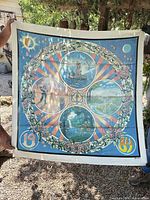Full view of entire blue cotton Grateful Dead poster held outdoors