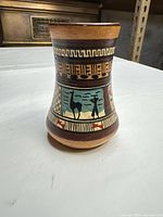 Front view of terracotta vase showing painted motifs