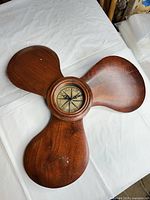 Full view of propeller-shaped wall clock