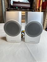 Front view of both Kenwood KS-358 speakers showing grilles and finish