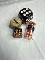 All five Harrah's dice and original tube