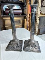 Front view pair columnar silver-plated candlesticks