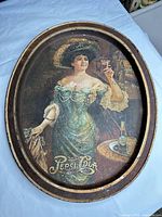 Full view of oval Pepsi-Cola tray showing entire design and wear