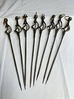 Eight skewers laid out showing full length and uniform design