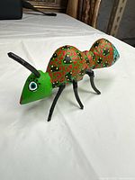 Right side view showing full body, paint pattern, legs, antennae
