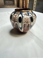 Front view showing marbled slip decoration and shape