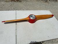 Full view of wooden propeller clock front