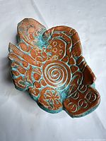 Top view showing turquoise glaze and relief patterns