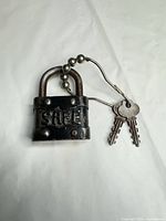 front view showing SAFE embossing, shackle, keys