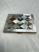 Front view showing full geometric abalone and mother-of-pearl inlay