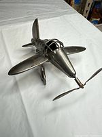 Top and front view showing propeller, wings, cockpit and surface condition