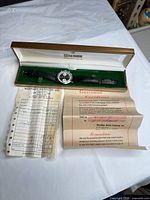 Watch, box, guarantee paperwork displayed