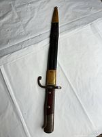 Full view bayonet sheathed in scabbard