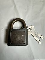 Front view of Yale 223 padlock with keys attached