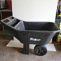 side view showing full cart, wheels, handle compartments