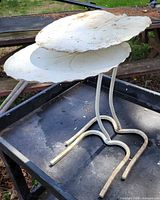Pair of wrought iron lily pad side tables on tray