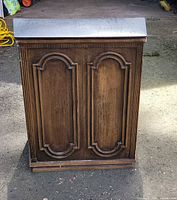 Front view showing wood finish and panel design
