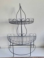 Front view showing entire two-tier wrought iron plant stand