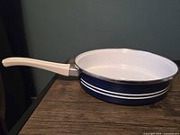 Left side view showing exterior color, stripes, and handle