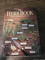 Front cover of "The Herb Book" showing title and authors