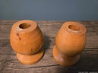 Both wooden candle holders front view