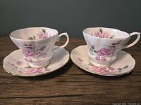 Pair of teacups and saucers front view