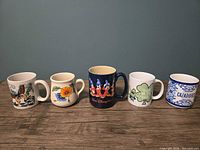 Front view of all five mugs lined up