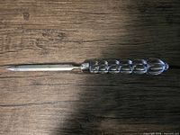 Full view of Mikasa letter opener displaying glass handle and metal blade