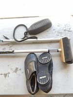 Curling shoes, bellows pump and stick ends
