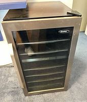 Front view showing glass door, handle, Danby logo