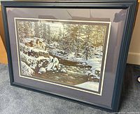 Front view of signed Kim Norlien winter landscape print in wood frame with double mat