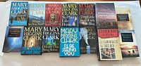 All fifteen hardcover books laid out, front covers visible