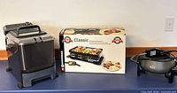 Overall lot: boxed Swissmar raclette grill, deep fryer, fondue pot