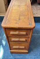 Top and drawer front of oak chest