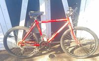 Full left-side view of red Ridge Runner mountain bicycle