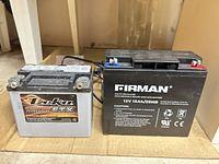 Front view of Firman 12V 15Ah battery and Deka ETX12 battery