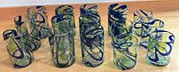 All 15 blue swirl green tint tumblers laid out